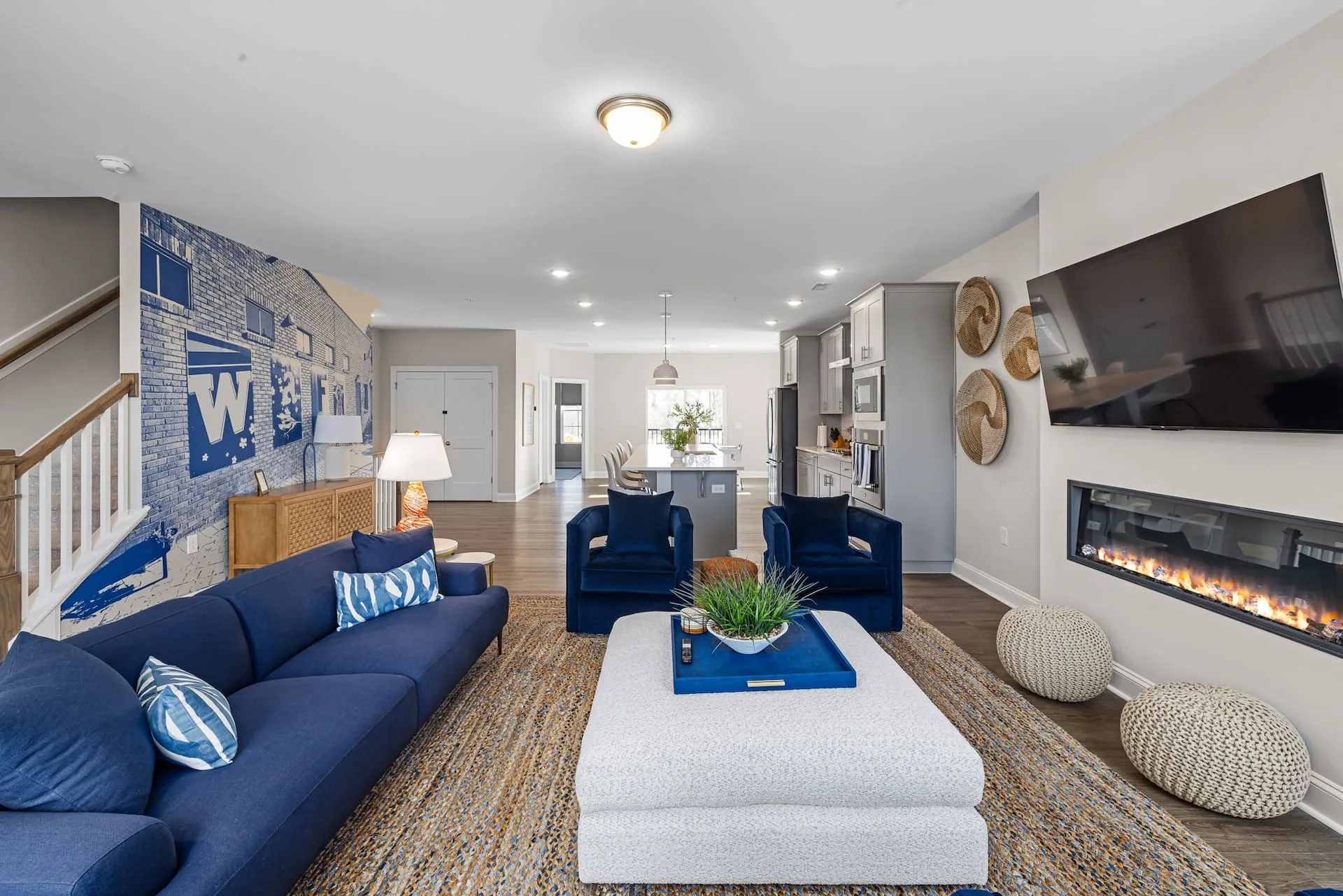 Spacious, stylish living room designed for groups to gather, unwind, and enjoy movie nights or game time