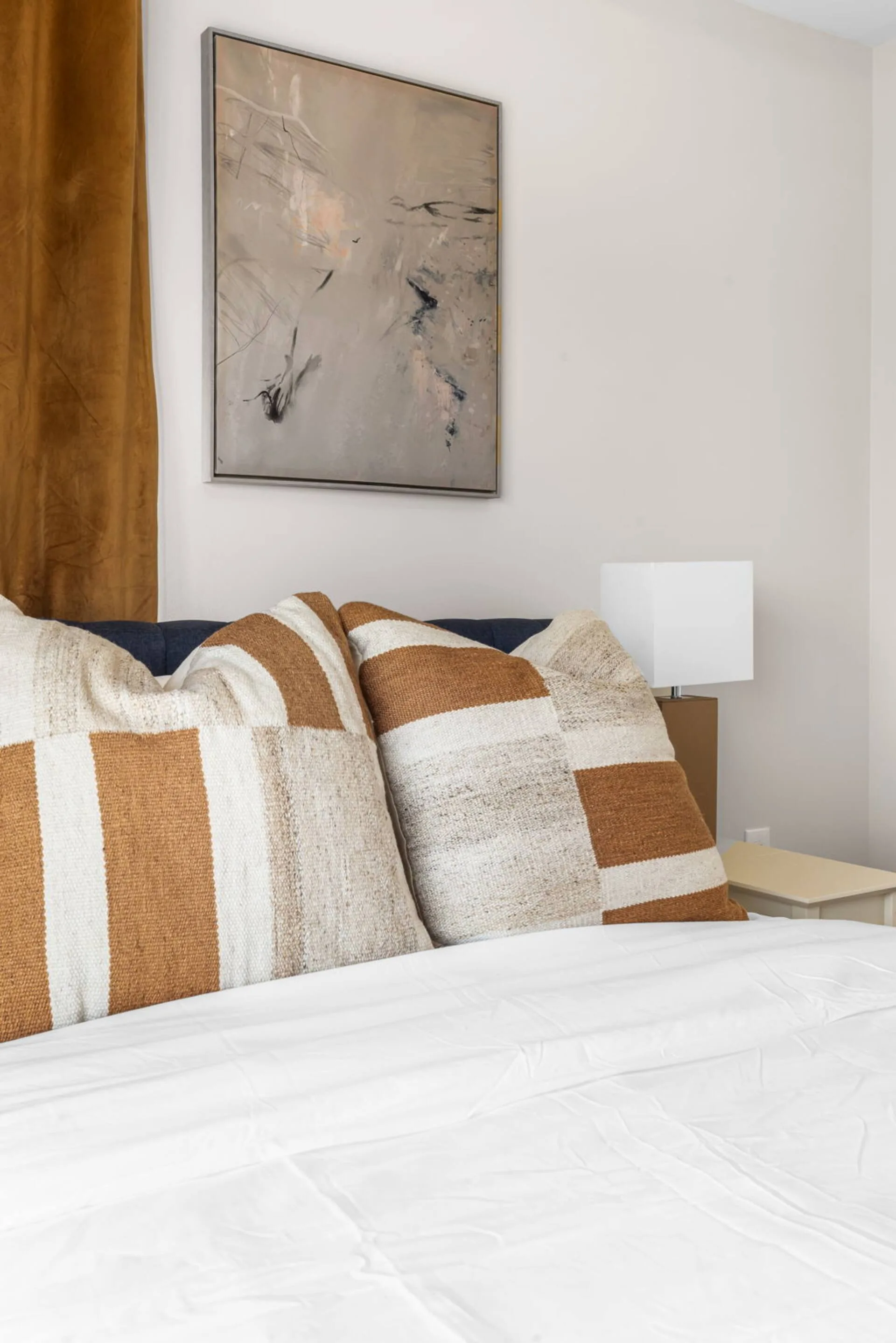 Comfortable queen bedroom with spacious closet and private balcony, perfect for relaxing mornings or winding down in the evening